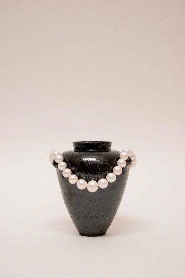 Artisanal handmade wheel-thrown ceramic vase tableware set. Dark Glaze ceramics. Hand built vessel with white pearl and silver necklace