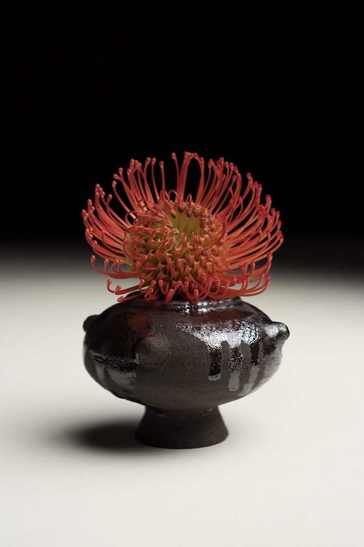 Artisan wheel-thrown ceramic cup experimental black glazing dark color